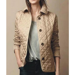 A stylish and versatile women's quilted jacket made from durable fabric, featuring a contemporary design that combines warmth and elegance, perfect for various occasions. 1