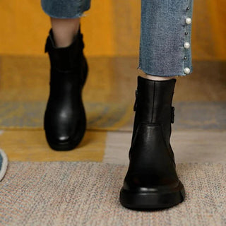 A pair of women's retro-style black boots, featuring a nostalgic design with a comfortable fit, crafted from high-quality materials for both durability and style. 4