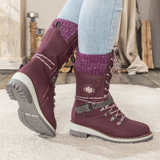 Stylish women's winter boots featuring a lace-up design, crafted from warm and comfortable materials, perfect for elegant outdoor adventures in cold weather. 8