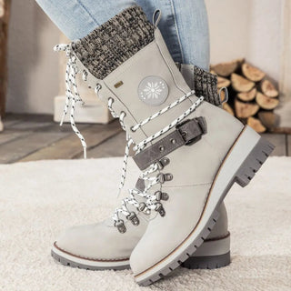 These women's boots feature a lace-up design, crafted from warm, comfortable materials that blend elegance with functionality, perfect for winter adventures. 9