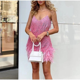 This women's cocktail dress features a glamorous design adorned with sequins, offering an elegant yet comfortable fit, perfect for special occasions. 7