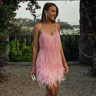 This women's cocktail dress features a glamorous design adorned with sequins, offering an elegant and comfortable fit, perfect for special occasions. 8
