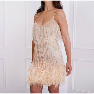 This women's cocktail dress features a glamorous design adorned with sequins, combining elegance and comfort for a stunning evening look. 9