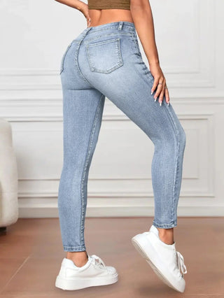 A pair of women's skinny fit jeggings featuring a high waist, crafted from a stretchy cotton blend material. These elegant jeggings are designed with functional pockets 1