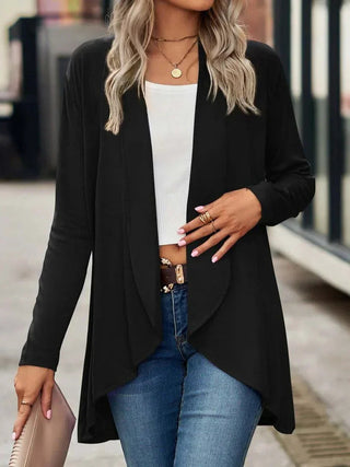 A women's cardigan in a relaxed H-line style, crafted from soft and breathable material, perfect for layering and casual wear. 0