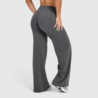 These women's yoga pants feature a wide-leg design for comfort and versatility, made from soft, breathable fabric ideal for workouts or casual wear. The relaxed fit 3
