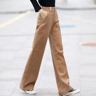 Stylish women's high-waisted trousers, featuring a wide-cut design, made from a soft, breathable fabric. These modern and versatile pants are perfect for 2