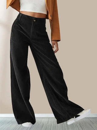 A pair of women's wide corduroy trousers featuring a relaxed fit and versatile style, crafted from soft cotton material for comfort and everyday wear. 0