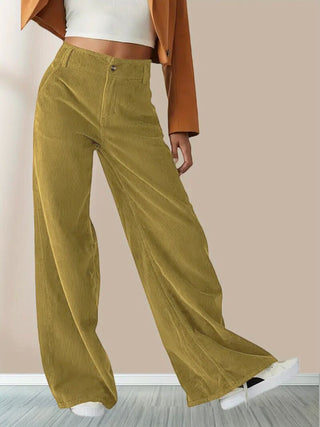 A pair of women's wide corduroy pants in a casual and versatile style, made from soft, durable cord fabric, featuring a relaxed fit that offers 1