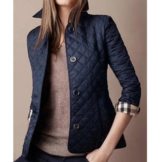 Stylish and versatile women's puffer jacket featuring a quilted design, made from lightweight, durable material, perfect for transitional weather and casual outings. 0