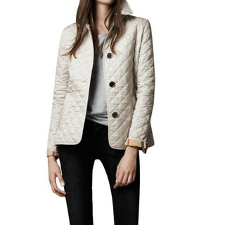 Stylish women's quilted jacket made of durable polyester, featuring a versatile design that easily complements various outfits, perfect for both casual and semi-formal occasions 4