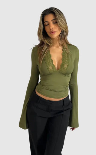 Elegant long-sleeved women's top made from soft fabric, featuring delicate lace detailing for a versatile and stylish look, suitable for various occasions. 0