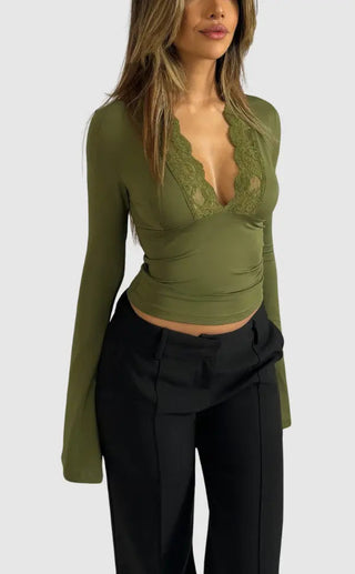 A women's long-sleeve top made of soft fabric, featuring elegant lace detailing, perfect for versatile styling in both casual and formal settings. 1