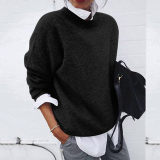 A women's sweater featuring a simple design, made from warm cotton, offering both comfort and elegance, ideal for casual or semi-formal occasions. 2