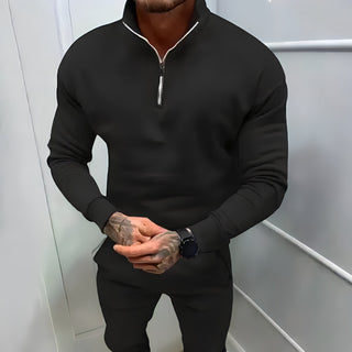A men's half-zip pullover in a sporty fit, crafted from soft, durable material. Its elegant and versatile design makes it suitable for both casual 0