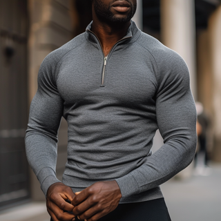 A men's pullover featuring a half-zip design, crafted from soft, breathable material. It offers a sporty fit, combining elegance and versatility, making 7