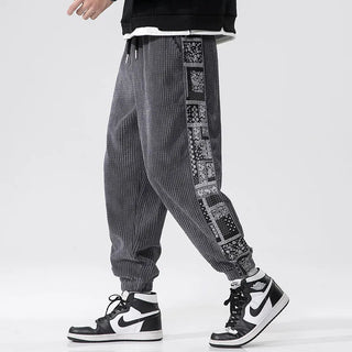 This men's corduroy pants feature a relaxed fit and stylish side print, crafted from soft cotton for comfort. The modern design makes them versatile for casual 1
