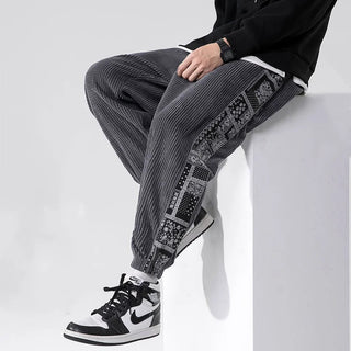 Men's corduroy pants featuring a relaxed fit and stylish side print, made from soft cotton fabric. These modern and versatile trousers are perfect for casual 4