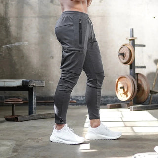 Stylish men's jogging pants featuring a sporty cut, made from comfortable and breathable fabric, perfect for various activities and casual outings. 7