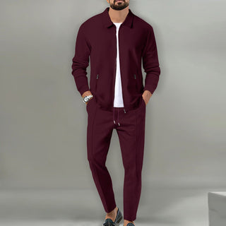 A stylish men's training suit featuring a full-zip jacket made from soft, breathable material, designed for comfort and a modern look, perfect for workouts or 3