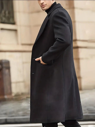 A stylish men's trench coat in classic black, made from water-repellent material, featuring an elegant design perfect for both formal and casual occasions. 1
