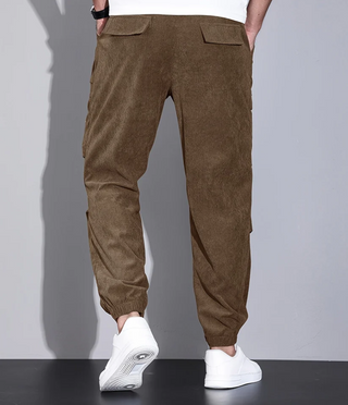 These men's trousers feature a classic design with practical pockets, crafted from durable fabric for versatility and comfort, making them suitable for both casual and formal occasions. 5