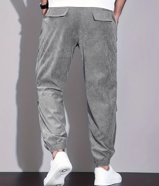 Men's classic trousers made from durable fabric, featuring practical pockets and a versatile design suitable for various occasions. 8
