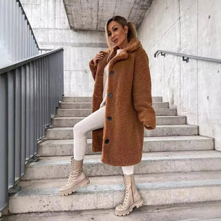 A women's long teddy coat in a chic and elegant style, made from soft, warm material, perfect for winter wear. The coat features a cozy silhouette 1