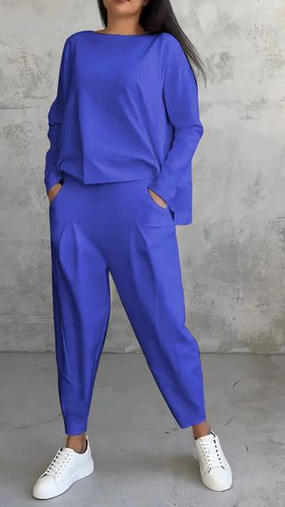 A women's co-ord set featuring an elegant design, crafted from comfortable fabric, perfect for versatile outfits. The stylish ensemble includes a fitted top and matching 5