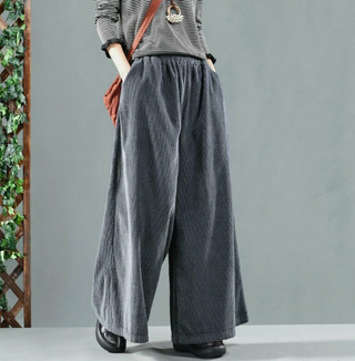 A pair of women's vintage-style trousers featuring a wide-leg design, crafted from soft fabric for comfort. These elegant and versatile pants can be dressed up or 1