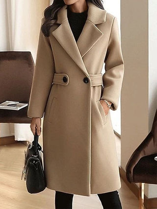 A long black coat for women, made from high-quality material, featuring an elegant and timeless design, perfect for winter wear. 0