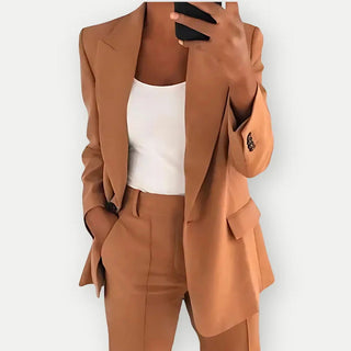 A women's gray blazer featuring an elegant cut, designed for versatility and comfort, made from high-quality fabric, perfect for both professional and casual occasions. 5
