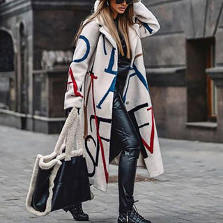 A women's oversized winter coat featuring an artistic and elegant design, crafted from warm, high-quality fabric to provide both style and comfort during colder months. 0