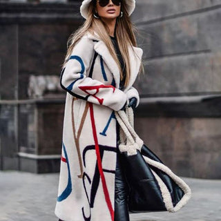 A women's oversized winter coat featuring an artistic and elegant design, made from warm, high-quality fabric, perfect for stylish layering in cold weather. 1