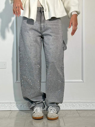 A pair of women's baggy jeans made from soft, durable denim, featuring an artistic design and a relaxed fit for comfort, perfect for casual or creative 3