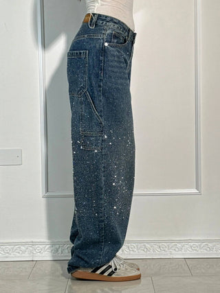 A pair of women's baggy jeans made from soft denim, featuring an artistic design. These comfortable trousers offer a relaxed fit, perfect for casual outings and 4