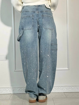 A pair of women's baggy jeans made from soft, durable denim, featuring a relaxed fit and artistic detailing for a trendy, comfortable look. Perfect for 6