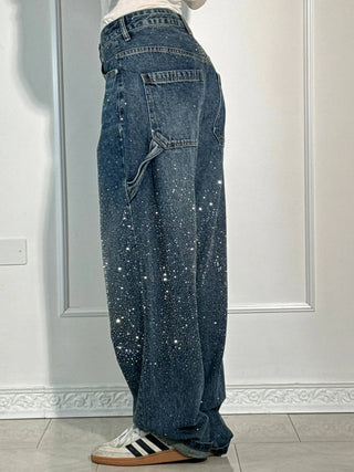 A pair of women's baggy jeans designed for comfort, featuring an artistic print. Made from soft denim, these stylish jeans offer a relaxed fit, perfect 8